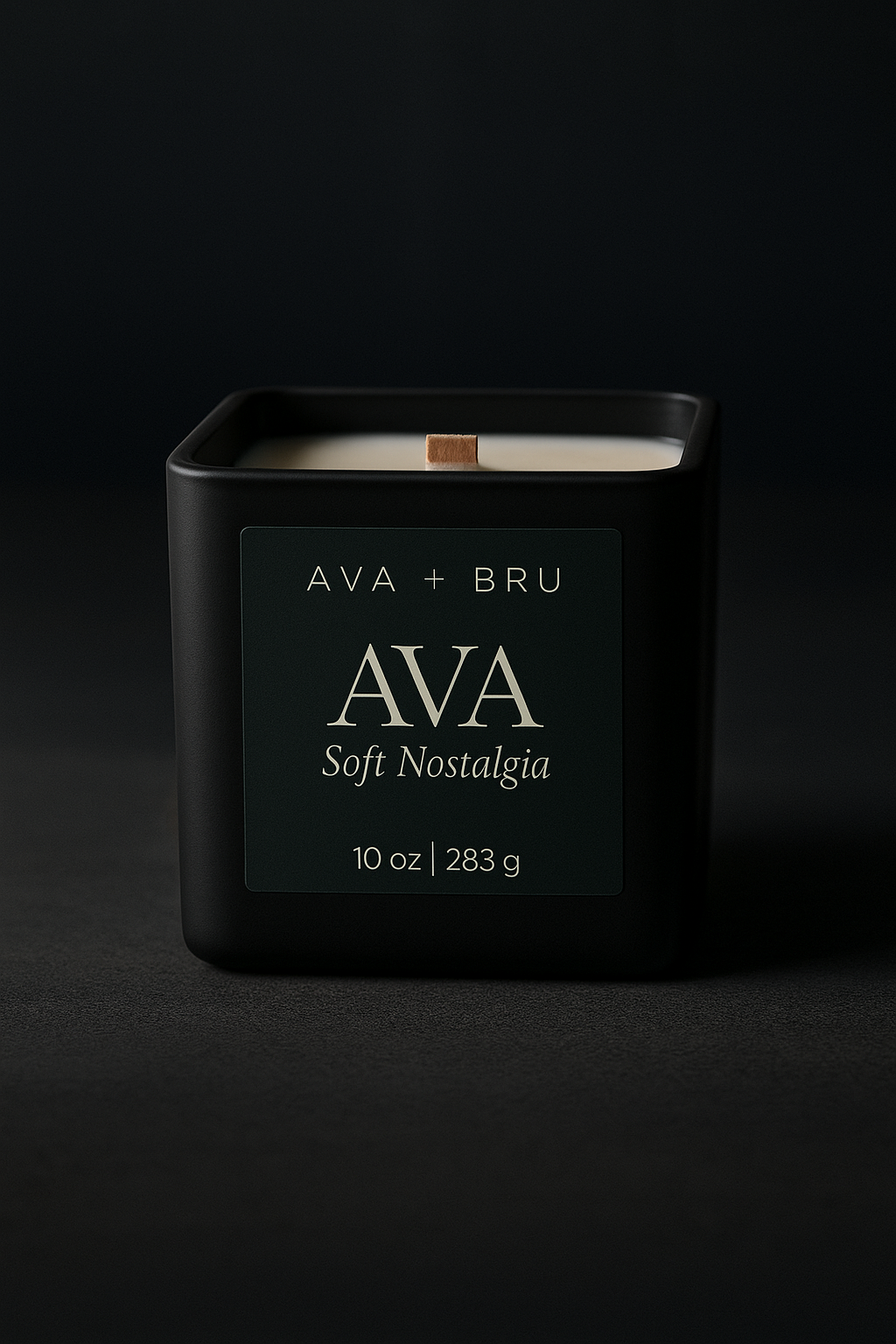 Black matte AVA candle with wood wick on a dark moody backdrop, labeled Soft Nostalgia.